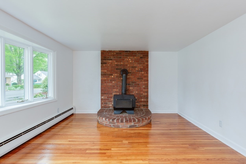 28 McKenney Circle Andover, MA 01810 - Photo 15 of 42 a living room with a fireplace