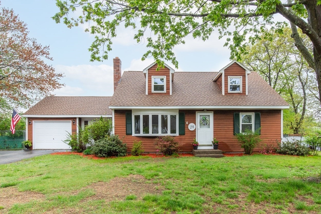 28 McKenney Circle Andover, MA 01810 - Photo 2 of 42 front view of a house with a yard