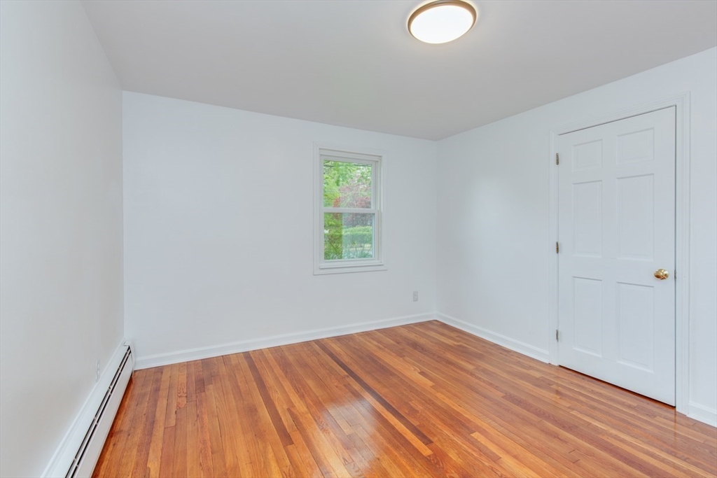 28 McKenney Circle Andover, MA 01810 - Photo 21 of 42 a view of room with window and hardwood floor