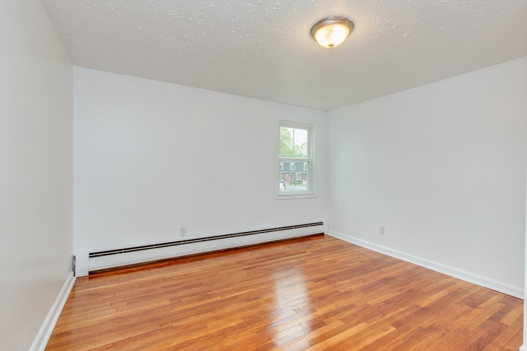 28 McKenney Circle Andover, MA 01810 - Photo 22 of 42 an empty room with a window