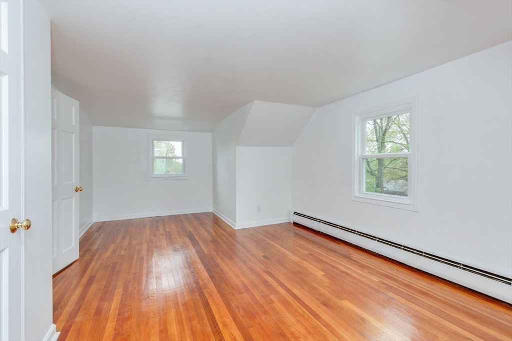28 McKenney Circle Andover, MA 01810 - Photo 32 of 42 wooden floor in an empty room with a window