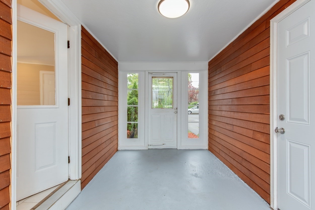 28 McKenney Circle Andover, MA 01810 - Photo 7 of 42 a view of a hallway with wooden shelves