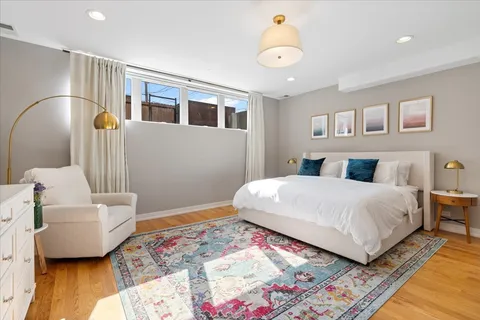 a bedroom with a bed and a couch