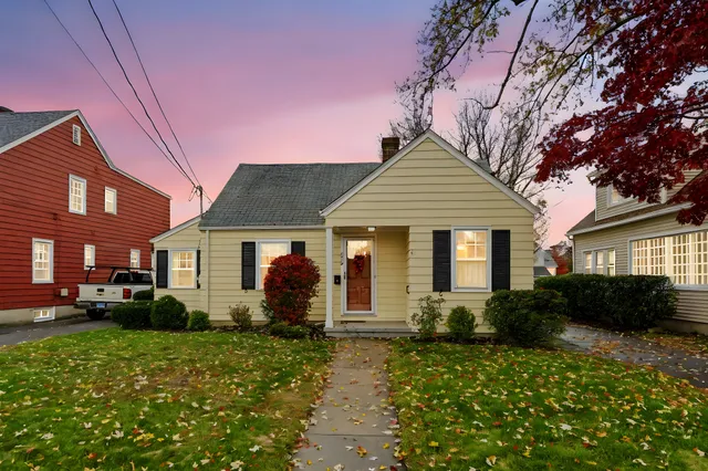 a front view of a house with a yard
