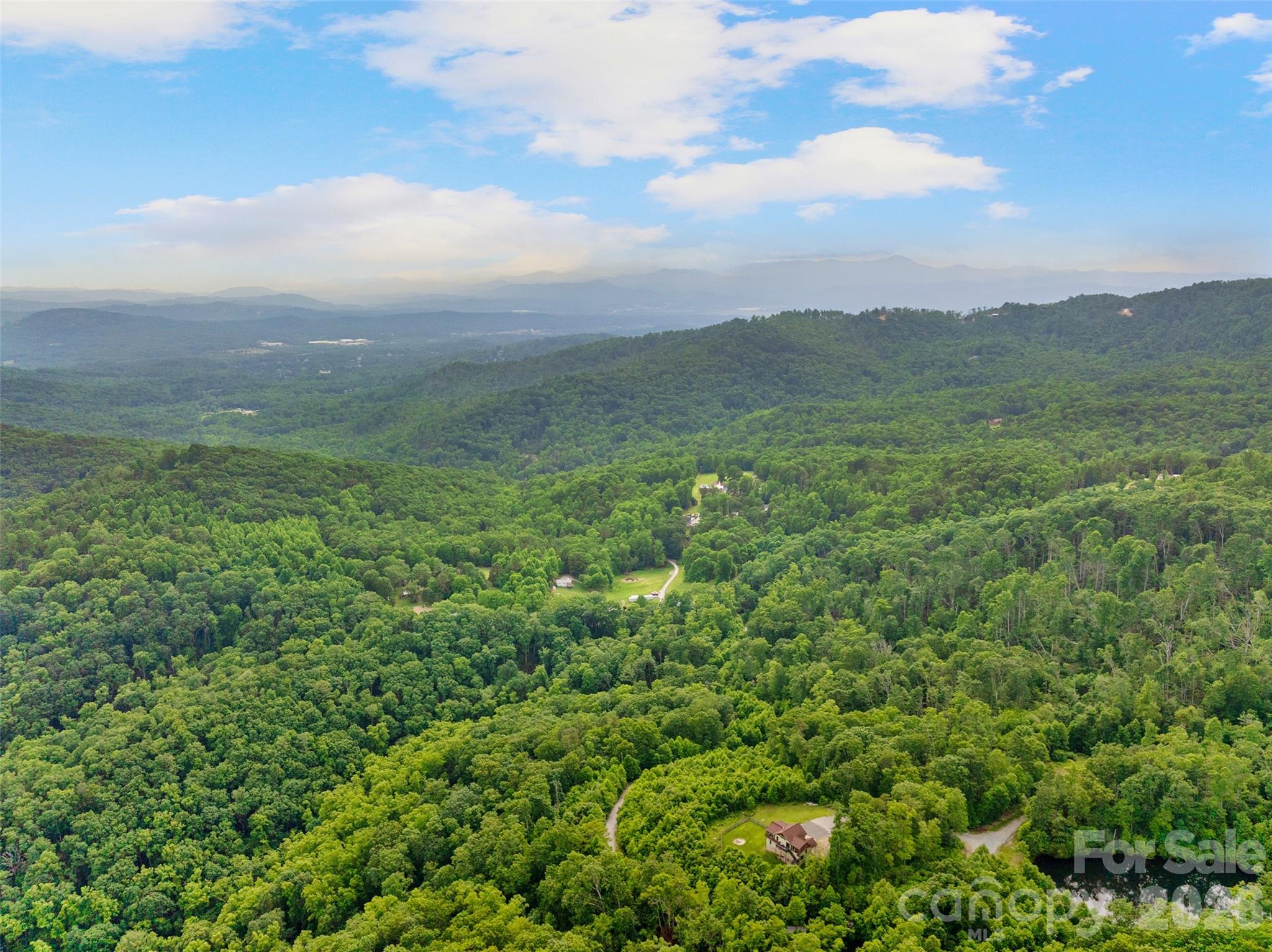 0 Locust Grove Road, Unit 2 Hendersonville, NC 28792 - Photo 18 of 19 a view of a lush green field
