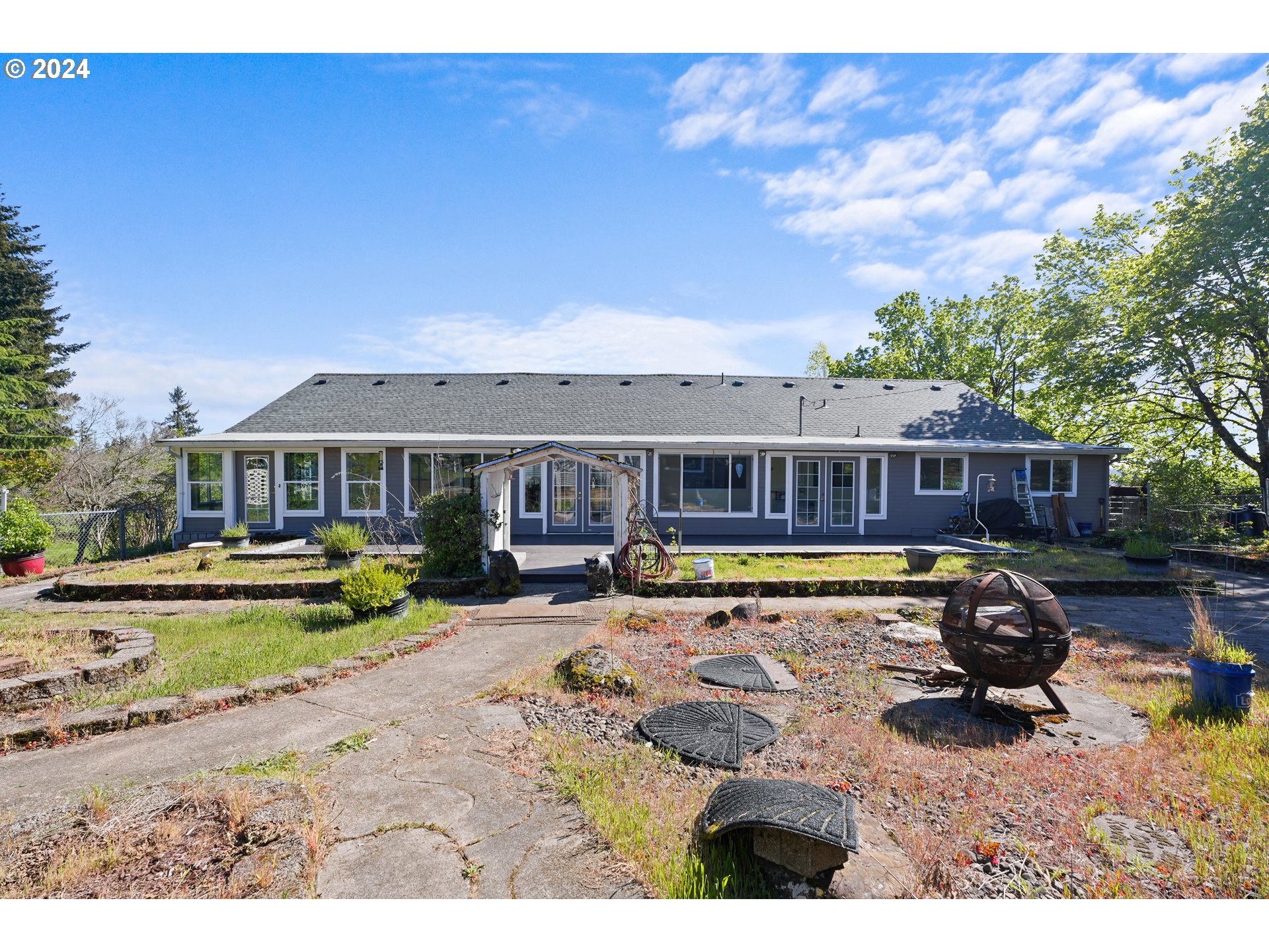 18787 Southeast Sunnyside Road Damascus, OR 97089 - Photo 1 of 36 a view of a house with swimming pool and sitting area
