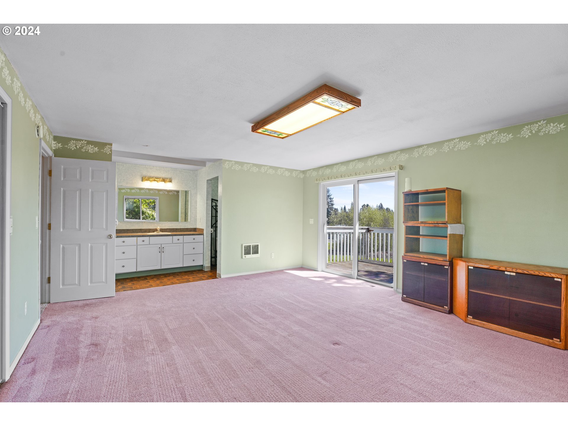 18787 Southeast Sunnyside Road Damascus, OR 97089 - Photo 19 of 36 a view of empty room with wooden floor and fan