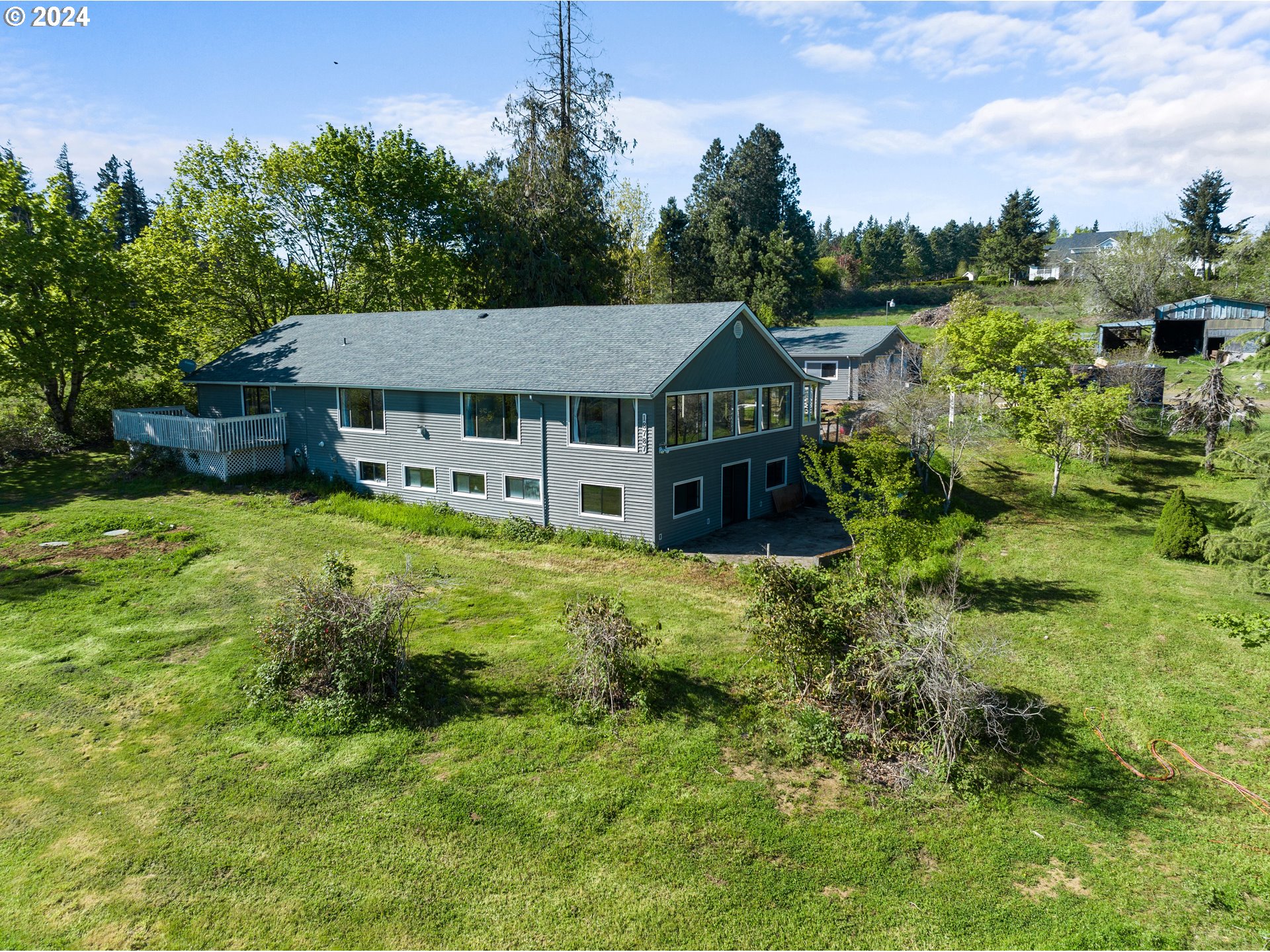 18787 Southeast Sunnyside Road Damascus, OR 97089 - Photo 2 of 36 a aerial view of a house with swimming pool and green space