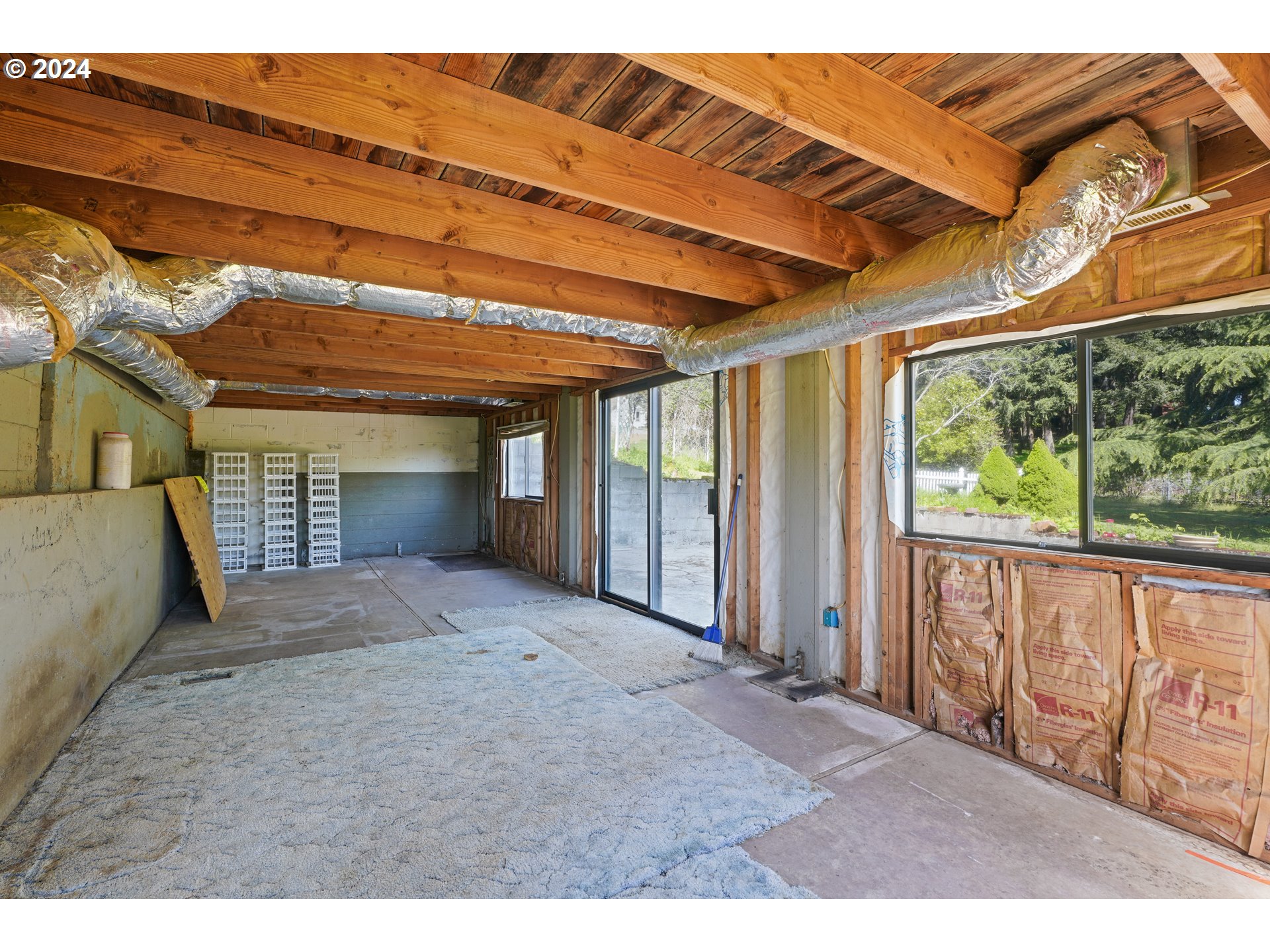 18787 Southeast Sunnyside Road Damascus, OR 97089 - Photo 24 of 36 a view of an empty room with wooden floor and a window