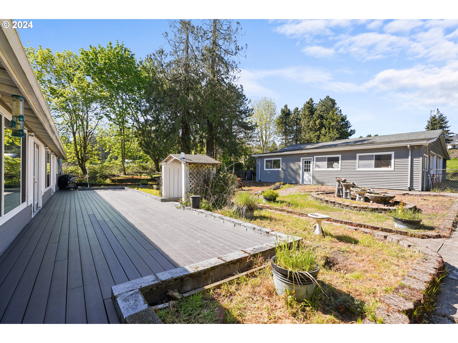 18787 Southeast Sunnyside Road Damascus, OR 97089 - Photo 27 of 36 a view of a house with pool and sitting area