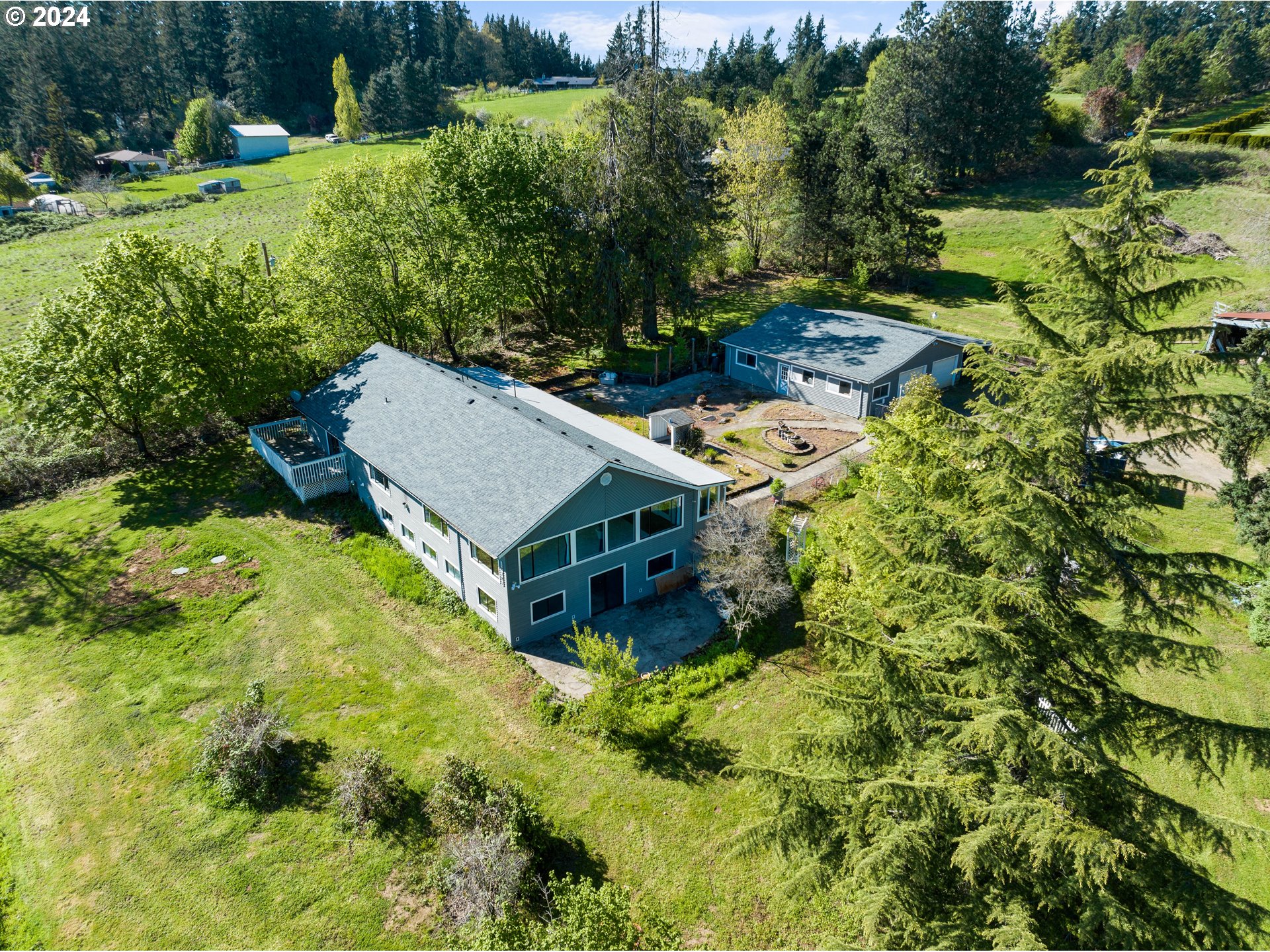 18787 Southeast Sunnyside Road Damascus, OR 97089 - Photo 32 of 36 a view of a house with a big yard