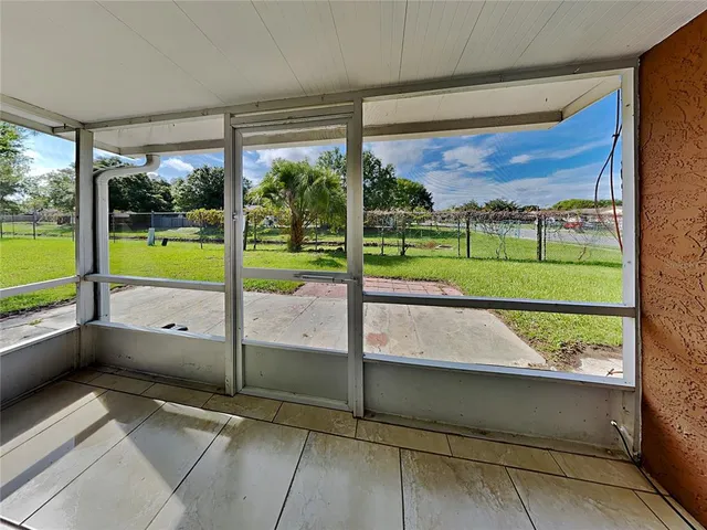 a view of an empty room with a large window