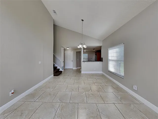 a view of a kitchen and a window