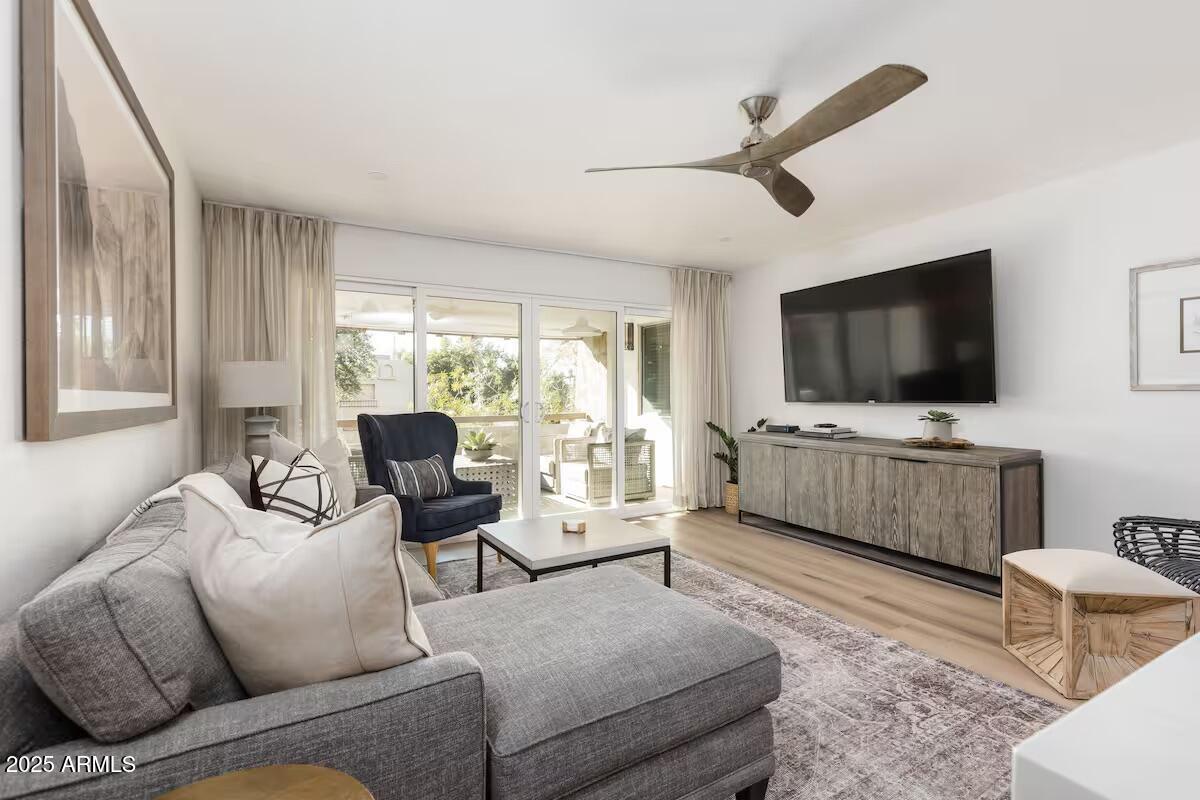 a living room with furniture and a flat screen tv