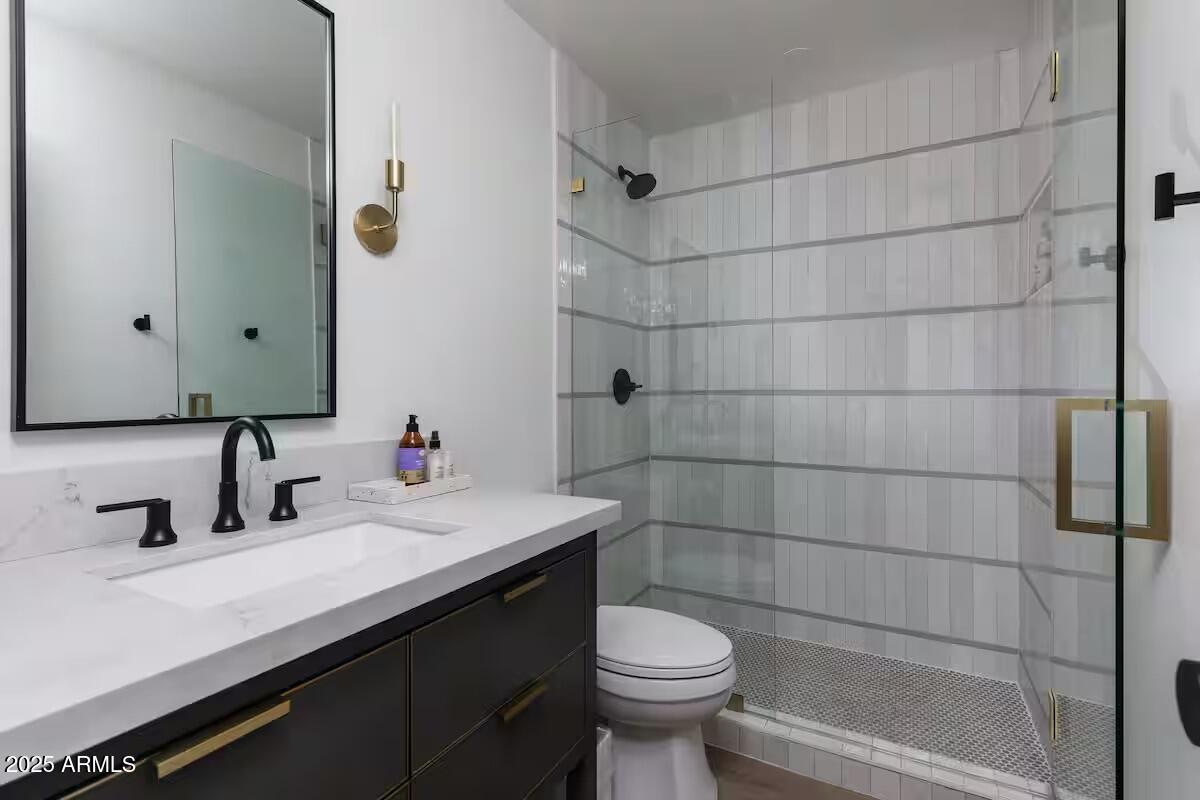 7625 East Camelback Road, Unit A252 Scottsdale, AZ 85251 - Photo 17 of 29 a bathroom with a sink and a toilet