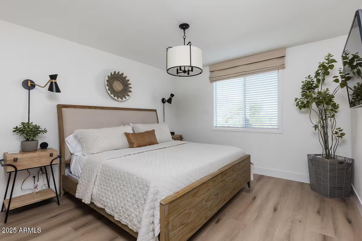 7625 East Camelback Road, Unit A252 Scottsdale, AZ 85251 - Photo 18 of 29 a bedroom with bed and a window