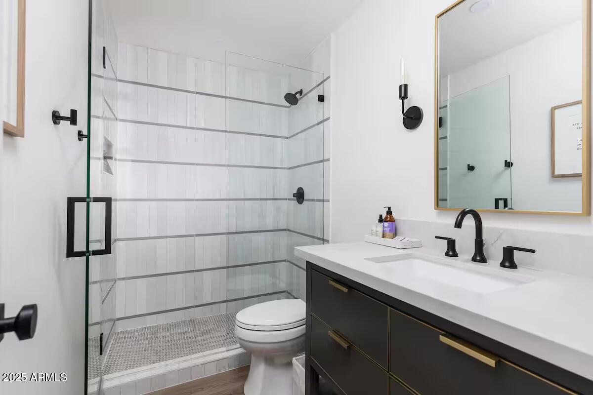 7625 East Camelback Road, Unit A252 Scottsdale, AZ 85251 - Photo 20 of 29 a bathroom with a sink a toilet and shower