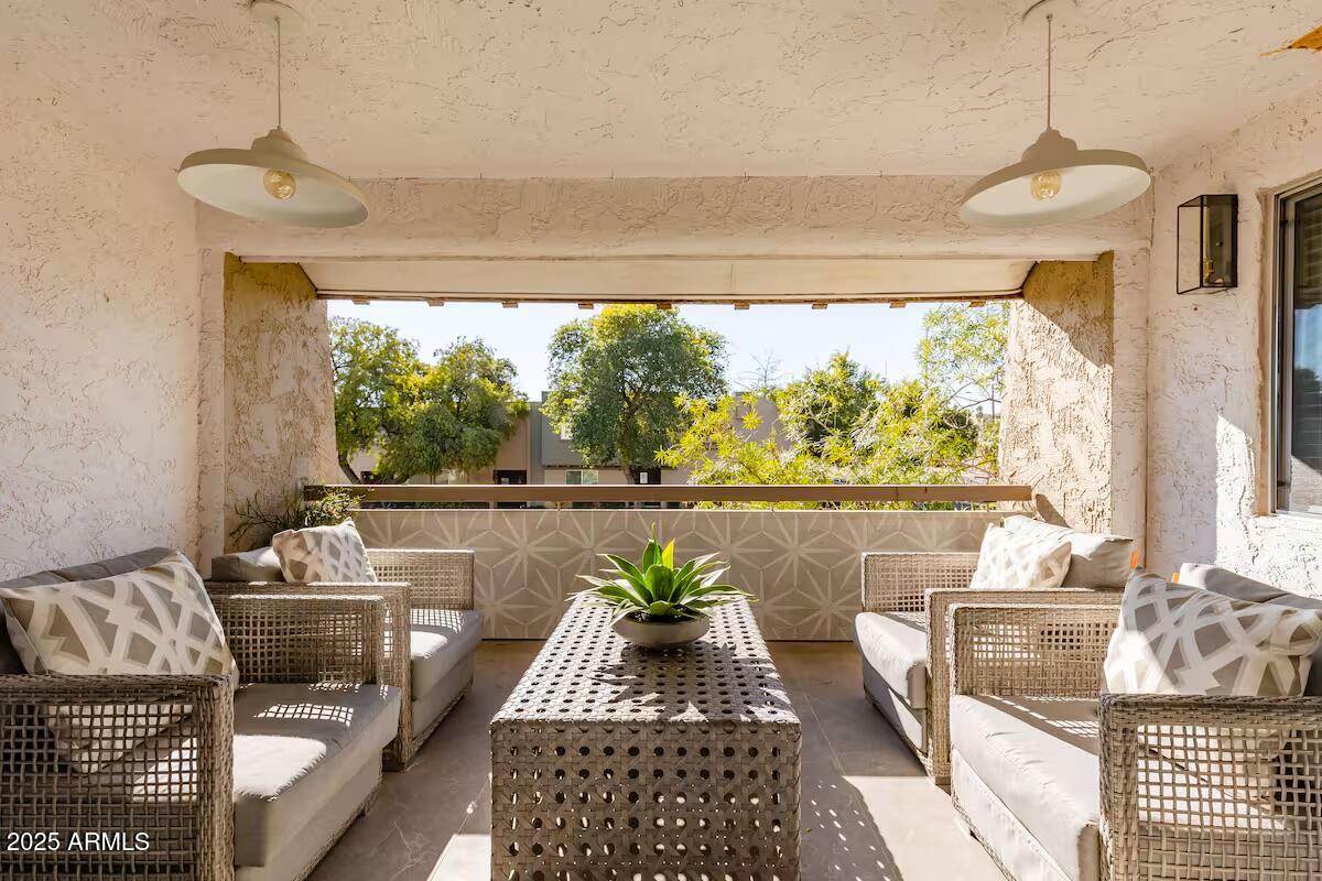 7625 East Camelback Road, Unit A252 Scottsdale, AZ 85251 - Photo 22 of 29 a living room with furniture and a large window