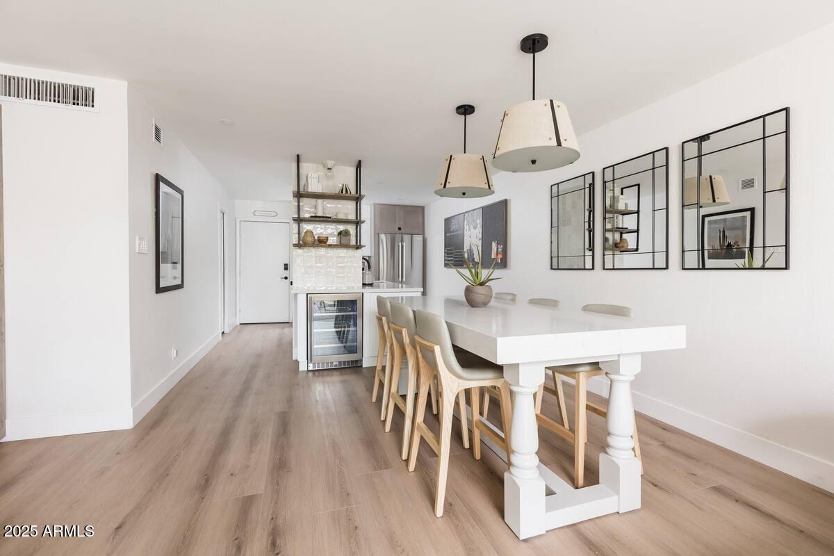 7625 East Camelback Road, Unit A252 Scottsdale, AZ 85251 - Photo 8 of 29 a very nice looking dining room with a table chairs and entryway