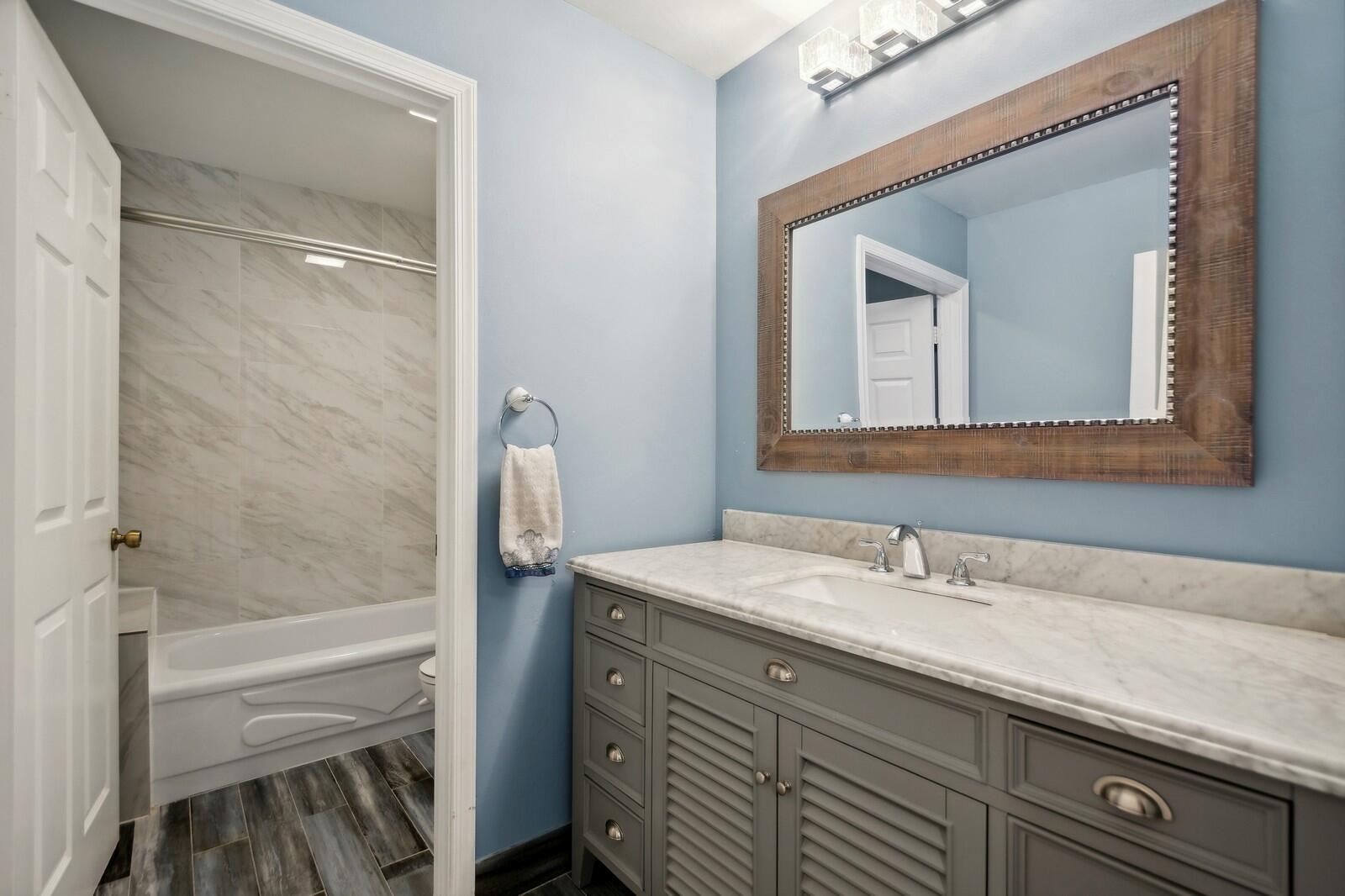 18287 Clear Brook Circle Boca Raton, FL 33498 - Photo 22 of 30 a bathroom with a sink and a mirror