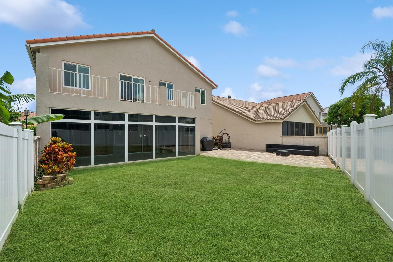 18287 Clear Brook Circle Boca Raton, FL 33498 - Photo 25 of 30 a view of a house with backyard and porch