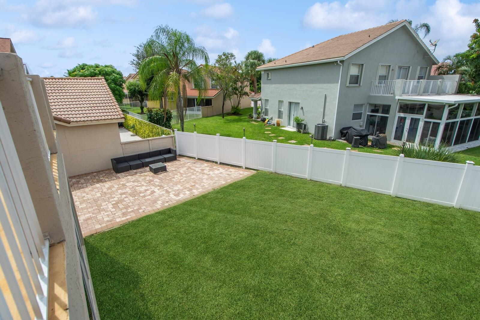 18287 Clear Brook Circle Boca Raton, FL 33498 - Photo 26 of 30 a view of house with backyard and outdoor seating
