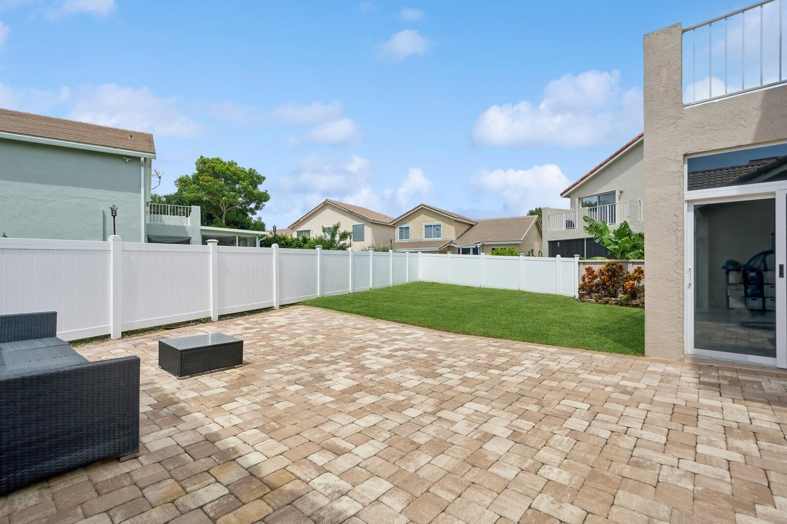 18287 Clear Brook Circle Boca Raton, FL 33498 - Photo 27 of 30 a view of a backyard with sitting area