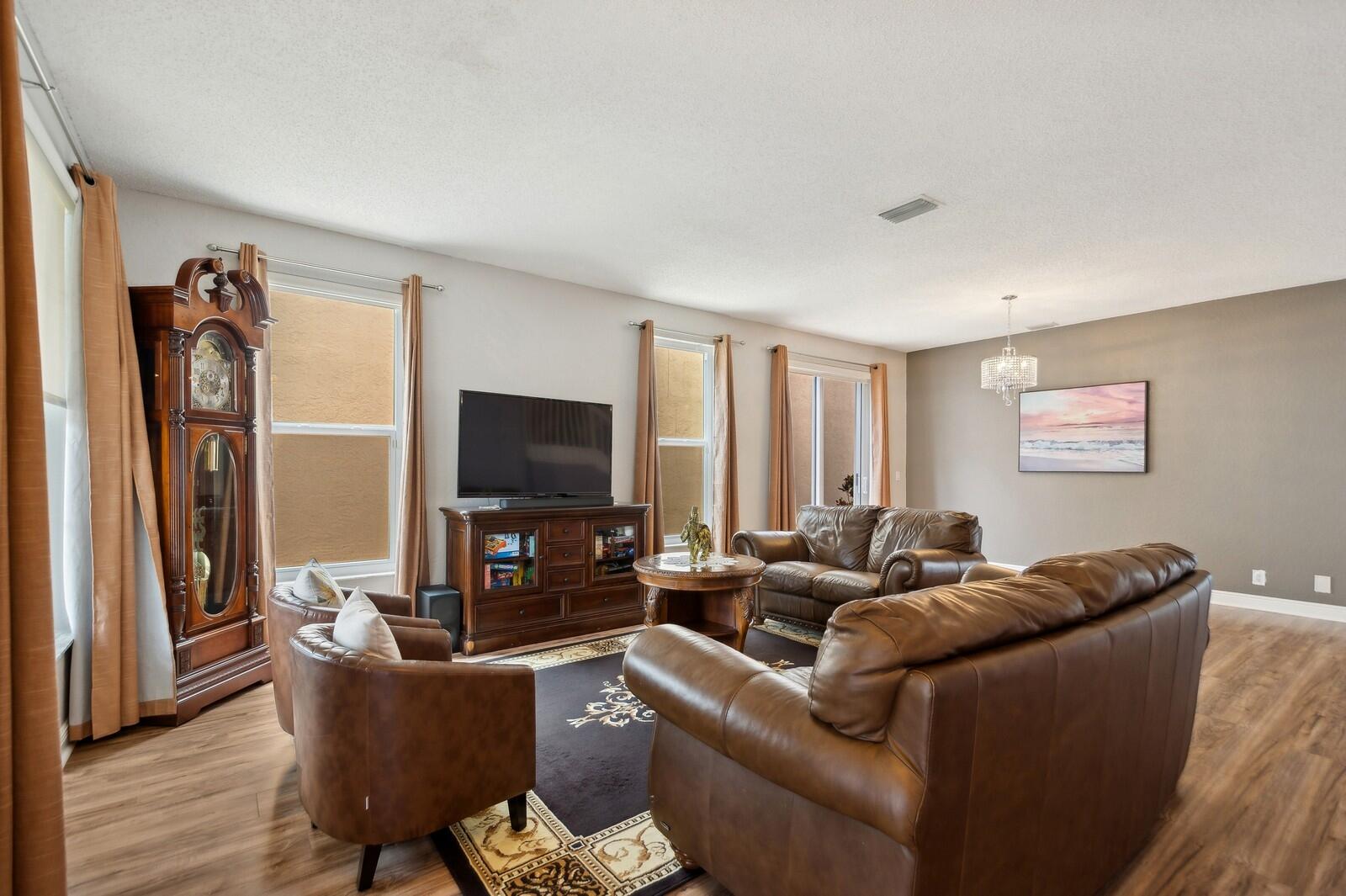 18287 Clear Brook Circle Boca Raton, FL 33498 - Photo 4 of 30 a living room with furniture and a flat screen tv