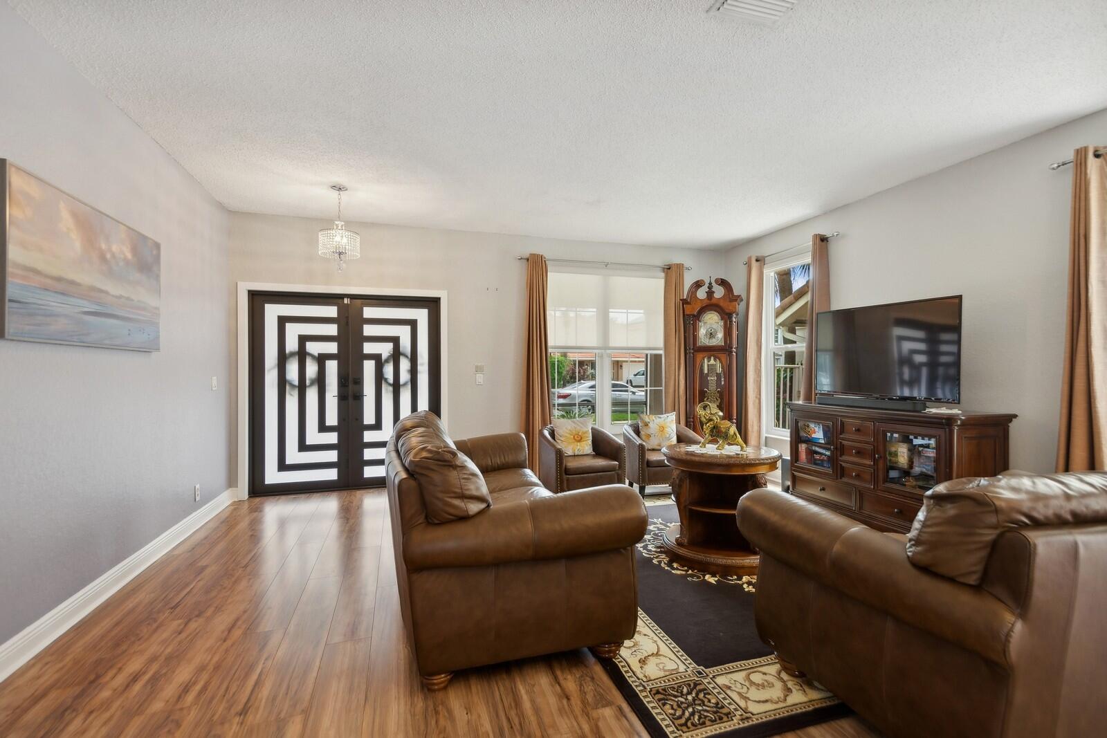 18287 Clear Brook Circle Boca Raton, FL 33498 - Photo 5 of 30 a living room with furniture and a flat screen tv