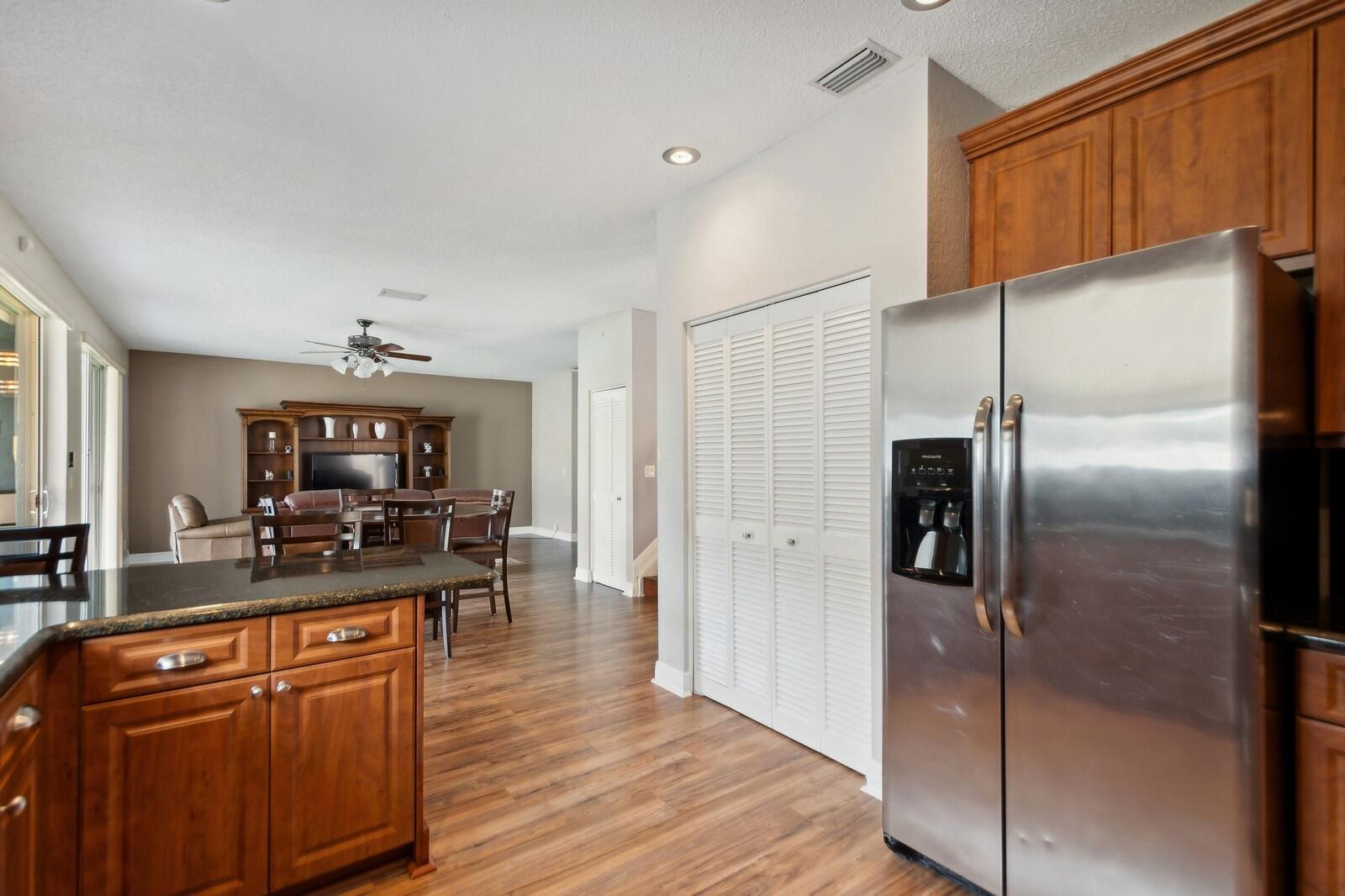18287 Clear Brook Circle Boca Raton, FL 33498 - Photo 10 of 30 a kitchen with a refrigerator and a counter top space