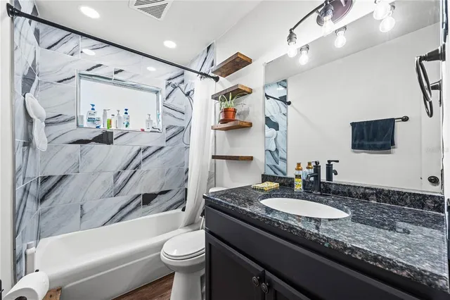 a bedroom with bed and window