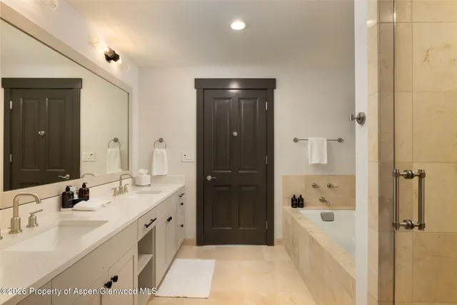 a bathroom with a bathtub and shower