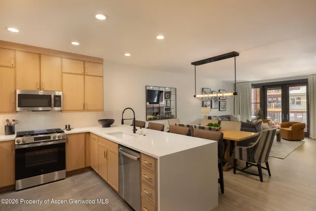 a kitchen with a sink stove and microwave