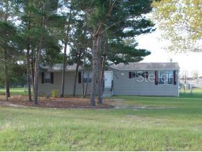 4070 Northeast 47th Street Ocala, FL 34479 - Photo 1 of 1 a view of a house with a yard