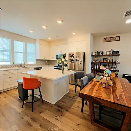 a view of a room with gym equipment and windows