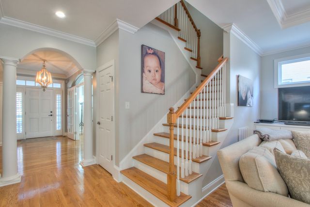 a view of entryway with wooden floor