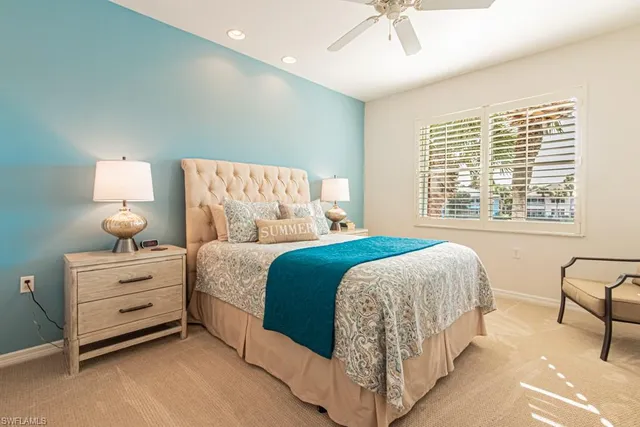 a bed room with a bed and a chair