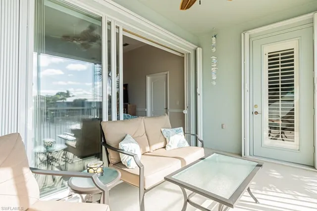 a living room with a large window and table