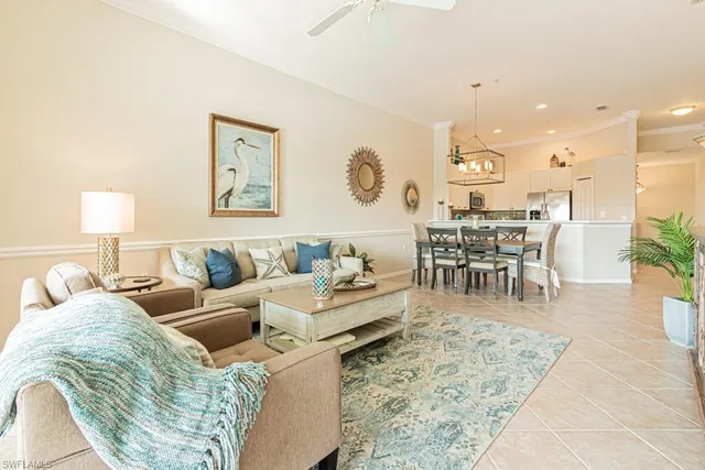 a living room with furniture wooden floor and a table