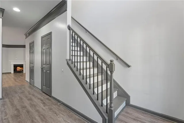 a view of an entryway with wooden floor