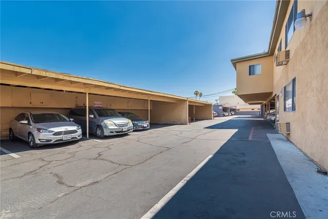 a view of a car parked in back of a building