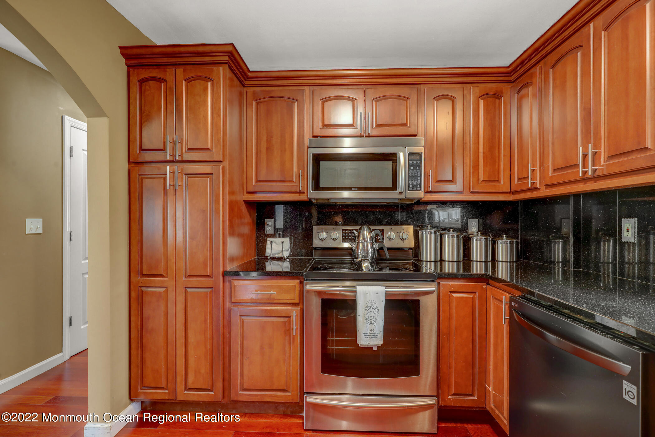 100 Maple Place Keyport, NJ 07735 - Photo 13 of 35 a kitchen with stainless steel appliances granite countertop a stove and cabinets