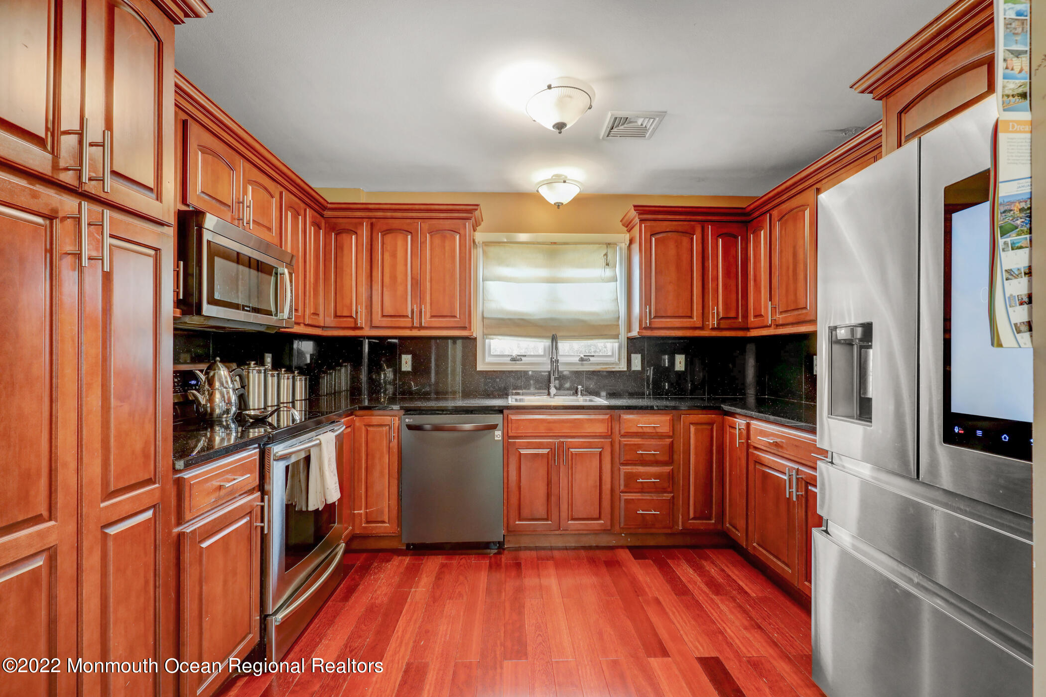 100 Maple Place Keyport, NJ 07735 - Photo 15 of 35 a kitchen with stainless steel appliances granite countertop a stove and a sink