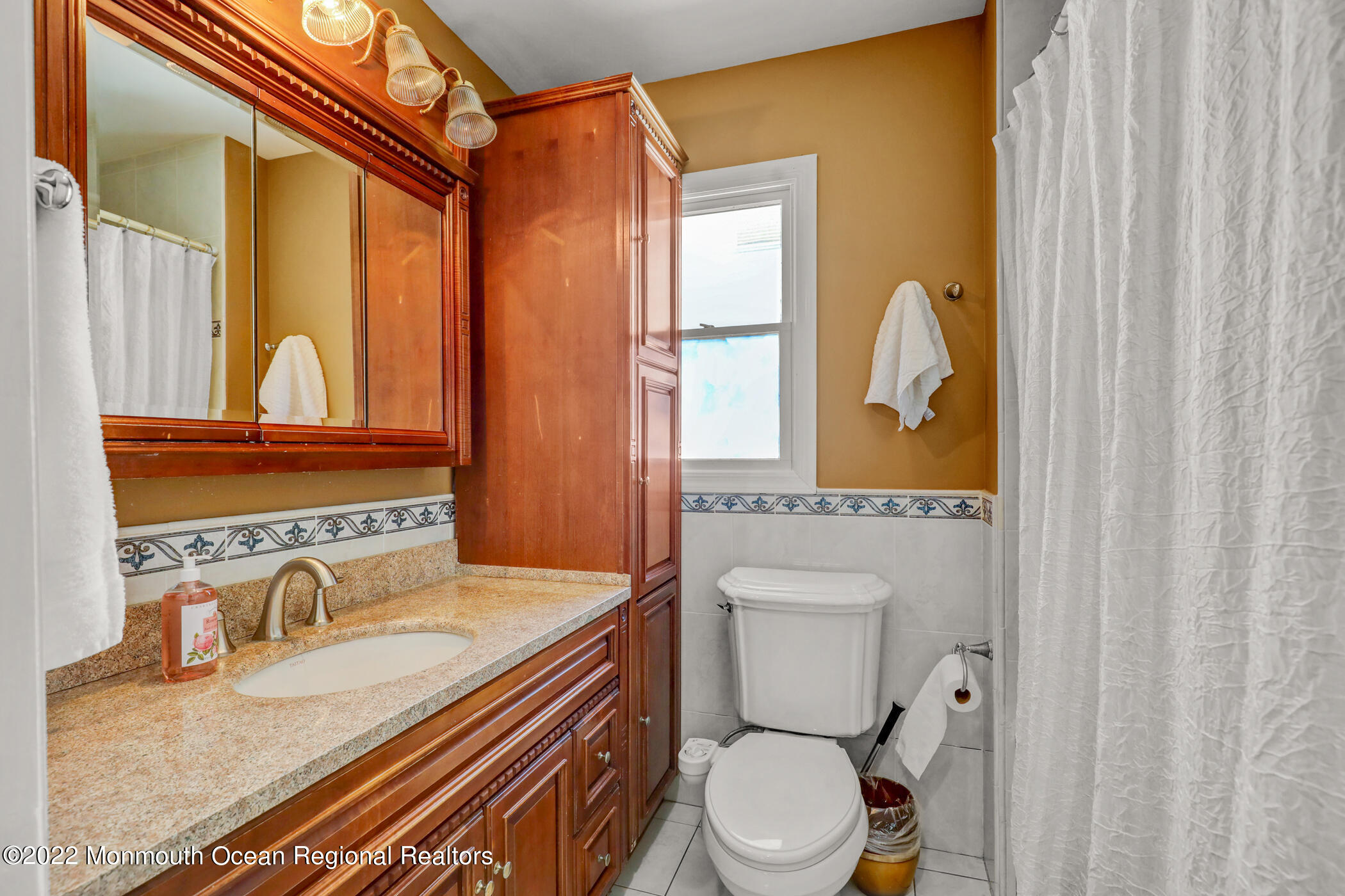 100 Maple Place Keyport, NJ 07735 - Photo 19 of 35 a bathroom with a granite countertop sink and a mirror