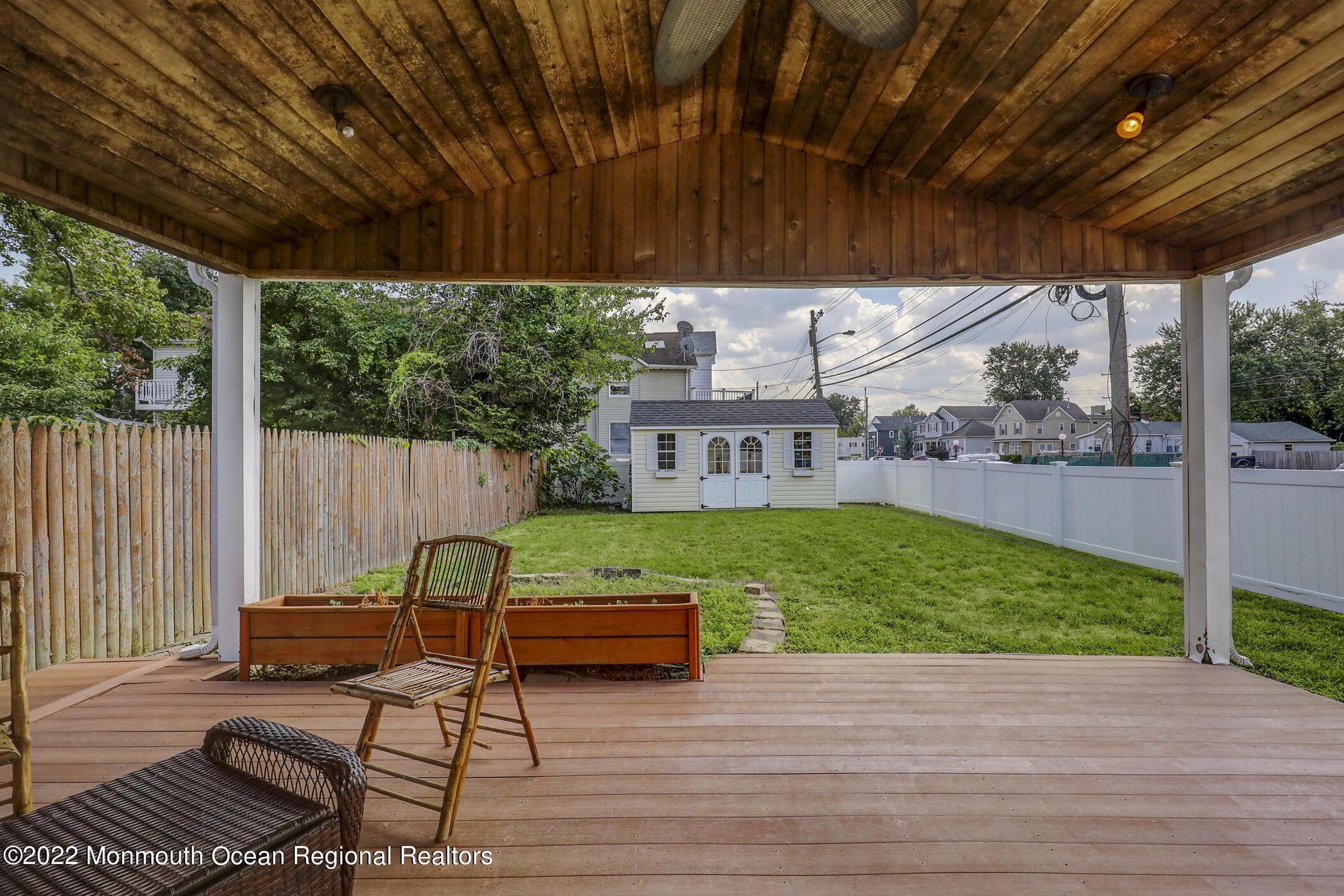 100 Maple Place Keyport, NJ 07735 - Photo 25 of 35 a view of a chairs in patio with wooden fence