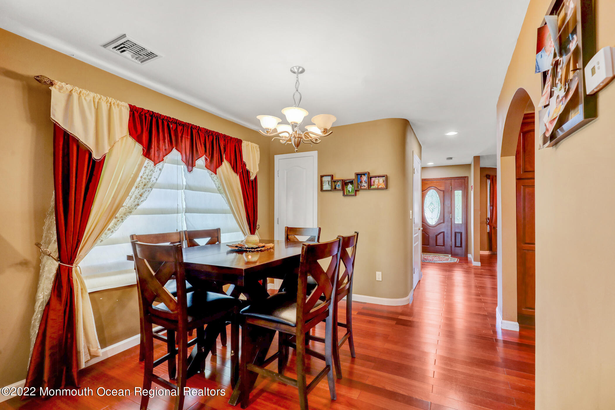 100 Maple Place Keyport, NJ 07735 - Photo 9 of 35 a dining room with furniture a chandelier and wooden floor