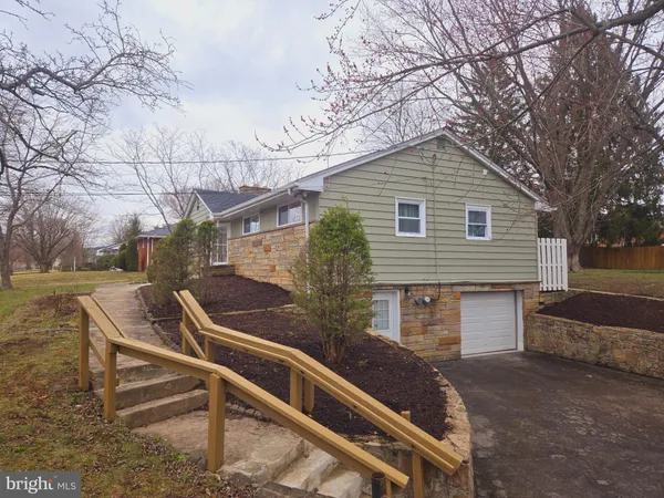 a living room with furniture windows and a fireplace