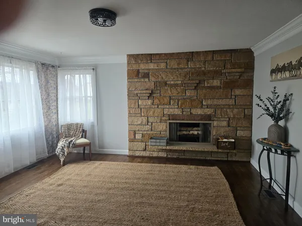 a kitchen with granite countertop a refrigerator and a sink