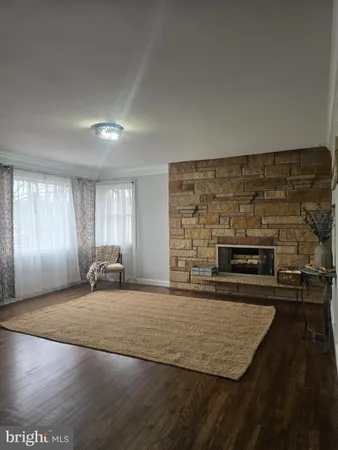 a kitchen with a refrigerator sink and cabinets