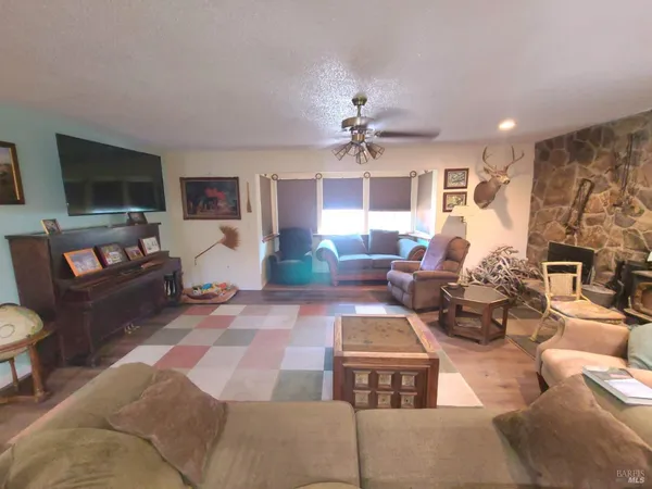 a room with wooden floor and furniture